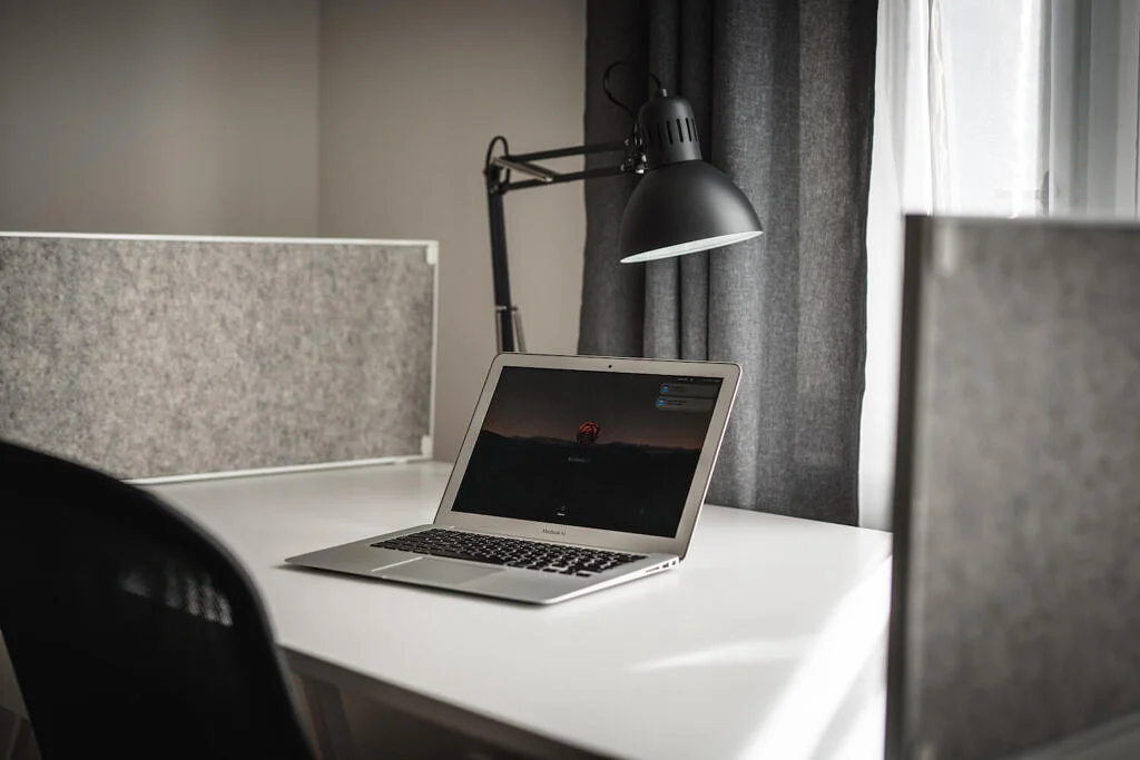 Pracovna workspace with desks and seating