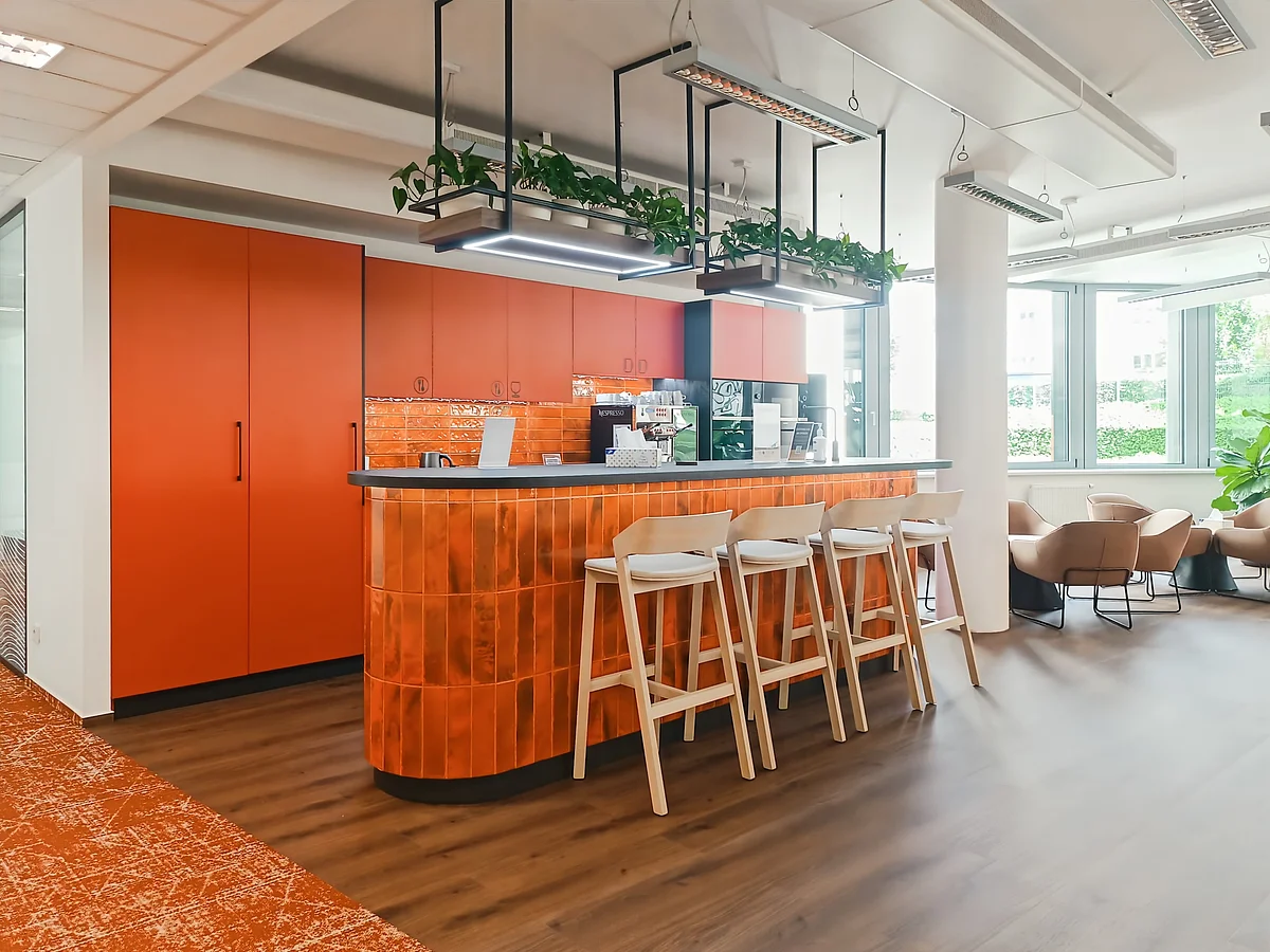 Shared kitchen with bar counter and high chairs